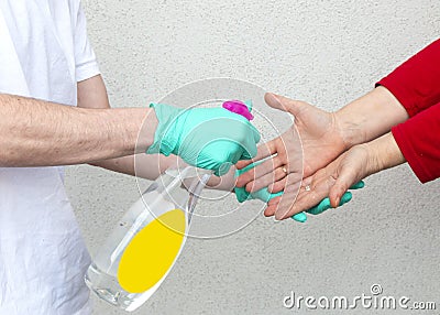 Closeup of a person sanitizing hands with hand sanitizer - COVID-19 Stock Photo