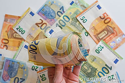 Closeup of a person& x27;s hand displaying an abundance of money Stock Photo