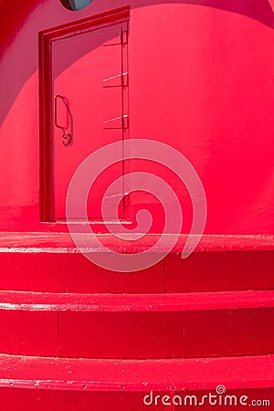 Closeup perspective view of red lighthouse door Stock Photo