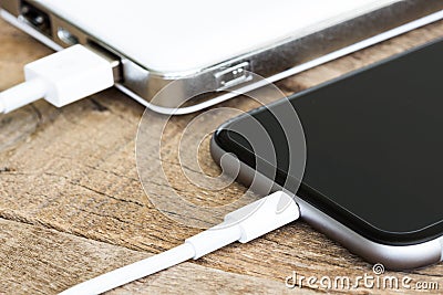 Closeup phone charging white power bank portable Stock Photo