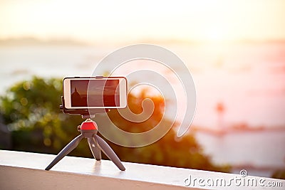 Closeup phone shooting time laps sunrise Stock Photo