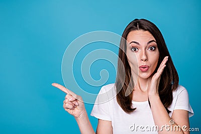 Closeup photo of attractive funny shocked lady good mood direct finger side empty space presenting novelty banner sale Stock Photo
