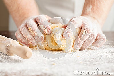 Closeup photo of baker making yeast dough for bread. Stock Photo