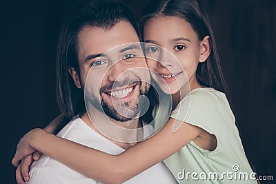 Closeup photo of beautiful little adorable lady and her handsome young daddy hugging dreamy toothy smiling spend weekend Stock Photo