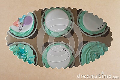 Closeup photo of colorful cupcakes in paper box Stock Photo