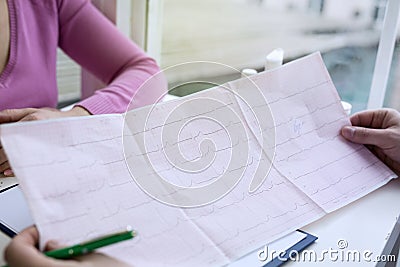 Closeup photo of ECG cardiogram pulse graph on a paper. Stock Photo