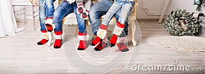 Closeup photo of family feet in wool socks Stock Photo