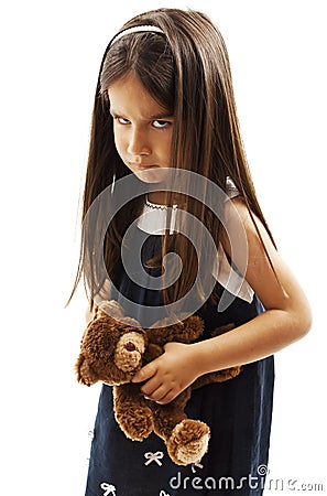 Closeup photo of little girl shows her furrowed brow and irritated frown Stock Photo