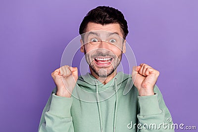 Closeup photo of millennial positive excited businessman fists up enjoy wish dreamy new playstation present isolated on Stock Photo