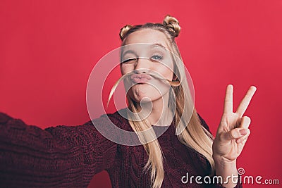 Closeup photo of pretty lady making false moustache with curl making selfies showing v-sign symbol wear knitted pullover Stock Photo
