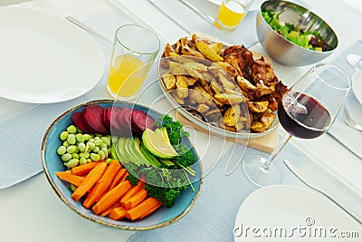 Closeup photo of served table with healthy vegetablesbowl and baked potato Stock Photo