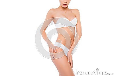 Closeup photo of slim woman with perfect body in underwear. Isolated on white background copy space. Cropped close up photo portra Stock Photo