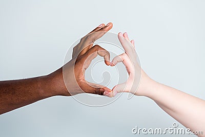 Closeup photo of two arms different race skin color multiracial couple best friends antiracism issue concept help Stock Photo