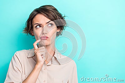 Closeup photo of young businesswoman touch cheeks pouted lips unsure looking empty space idea choose new product Stock Photo