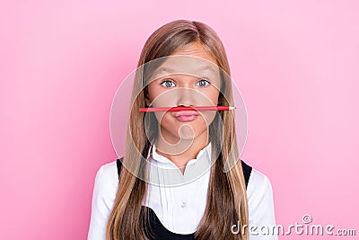 Closeup photo of young funny preteen cute schoolkid girl pouted lips playful childish pen positive good mood grimace Stock Photo