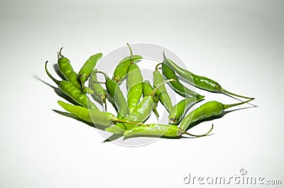 Closeup picture of green thin pepper on a white isolated background with shadows Stock Photo