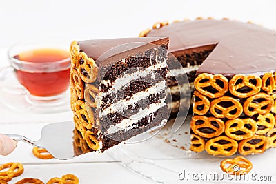 Closeup Piece of Homemade Chocolate Cake Decorated with Cookies. Stock Photo