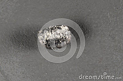 Closeup on a piece of the periodic element No.72 Hafnium Stock Photo