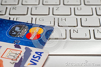 Closeup pile of credit cards, Visa payWawe and MasterCard Editorial Stock Photo