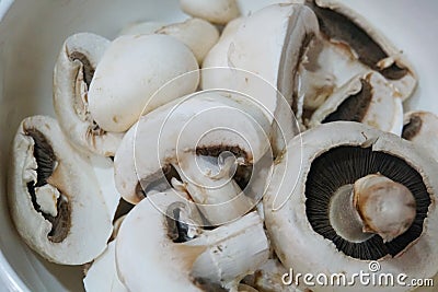 Closeup of a pile of raw white button mushrooms. Stock Photo