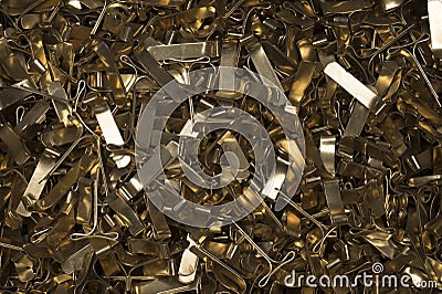 Closeup pile stack brass gold staples background Stock Photo