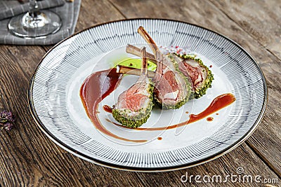 Closeup on plate of gourmet lamb cutlet ribs Stock Photo