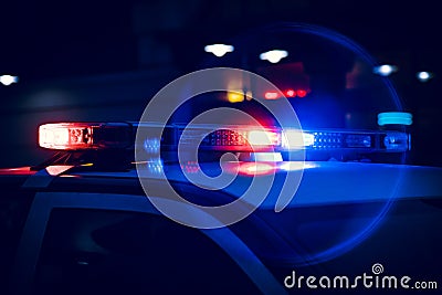 Closeup of Police Lights on Dark Street Stock Photo