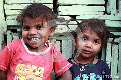 Closeup of a poor children smiling from New Delhi, India Editorial Stock Photo