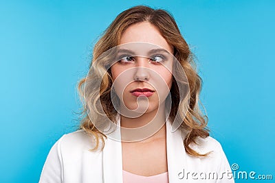 Closeup portrait of adorable funny woman looking cross-eyed with awkward silly dumb face. blue background Stock Photo