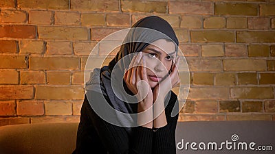 Closeup Portrait Of Adult Attractive Muslim Female In Hijab Watching A Horror Movie On TV While Sitting On The Couch Stock Video - Video of asian, faith: 144416609