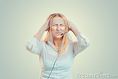 Woman hands in air aggravated talking on headset Stock Photo