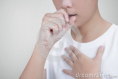 Closeup portrait of Asian people with a lot of coughs and chest pain, suffering with cough Stock Photo