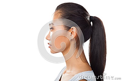 Closeup portrait of Asian young woman in profile with ponytail Stock Photo