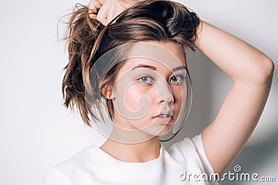 Closeup portrait of beautiful blue eyed girl looking at the camera Stock Photo