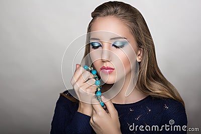 Woman holds beads Stock Photo