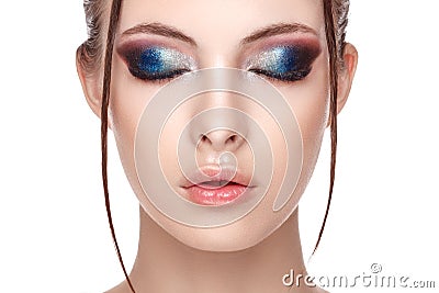 Closeup portrait of a beautiful young model with beautiful glamorous makeup , the wet effect on her face and body, eyes closed, co Stock Photo