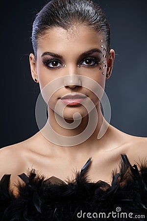 Elegant attractive woman with black boa Stock Photo