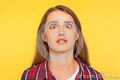 Closeup portrait of funny silly ginger woman in checkered shirt looking up cross eyed with stupid dumb face Stock Photo