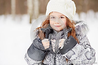 Closeup portrait of little girl in grey jacket with fur collar Stock Photo
