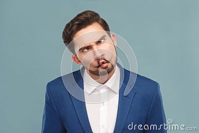 Closeup portrait of man with funny stupid mimicry face Stock Photo