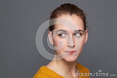 Portrait of a nervous young woman looking away, expressing doubt Stock Photo