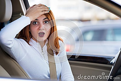 Closeup portrait of pissed off displeased angry aggressive woman driving a car shouting at someone. Negative human expression Stock Photo