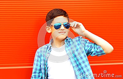 closeup portrait teenager boy in a sunglasses on a colorful Stock Photo