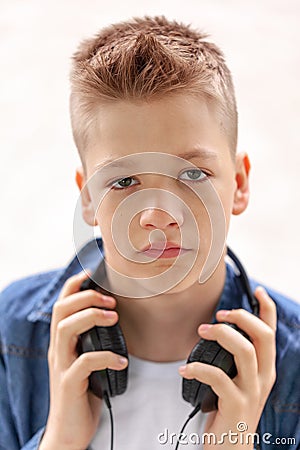 Closeup portrait teenager in headphones on white background Stock Photo