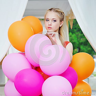 Closeup portrait of tender young woman with balloons Stock Photo