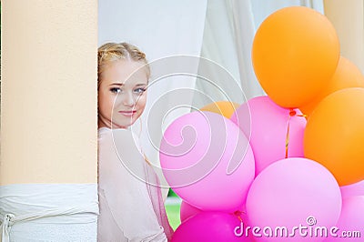 Closeup portrait of tender young woman with balloons Stock Photo