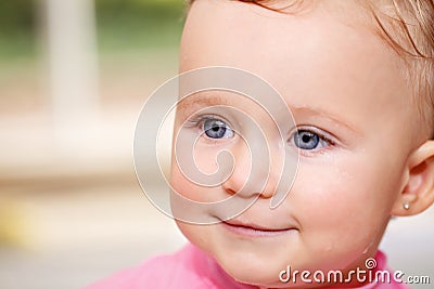 Closeup portrait of white Caucasian wet baby girl in water swimming pool inside Stock Photo