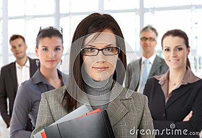 Closeup portrait of young businesswoman and team Stock Photo