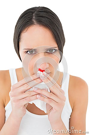 Closeup portrait of a young woman with bleeding nose Stock Photo