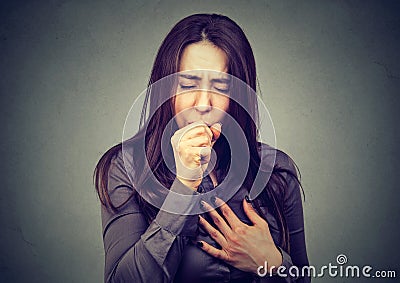 Closeup portrait of a young woman coughing Stock Photo